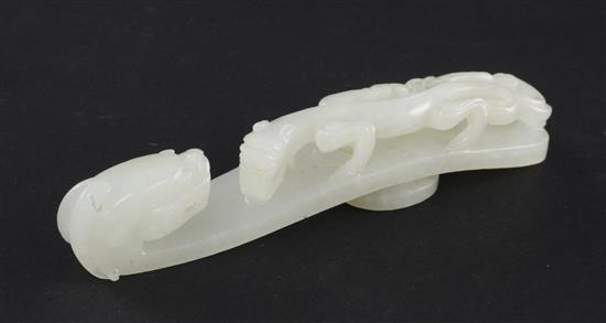 A Chinese white jade dragon belt hook, 18th / 19th century, 11.3cm